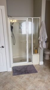 white frame glass shower door