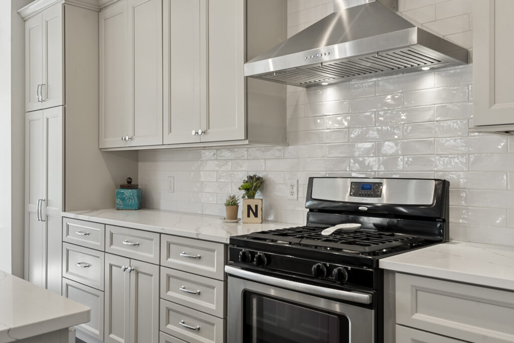 white cabinets and stainless hood